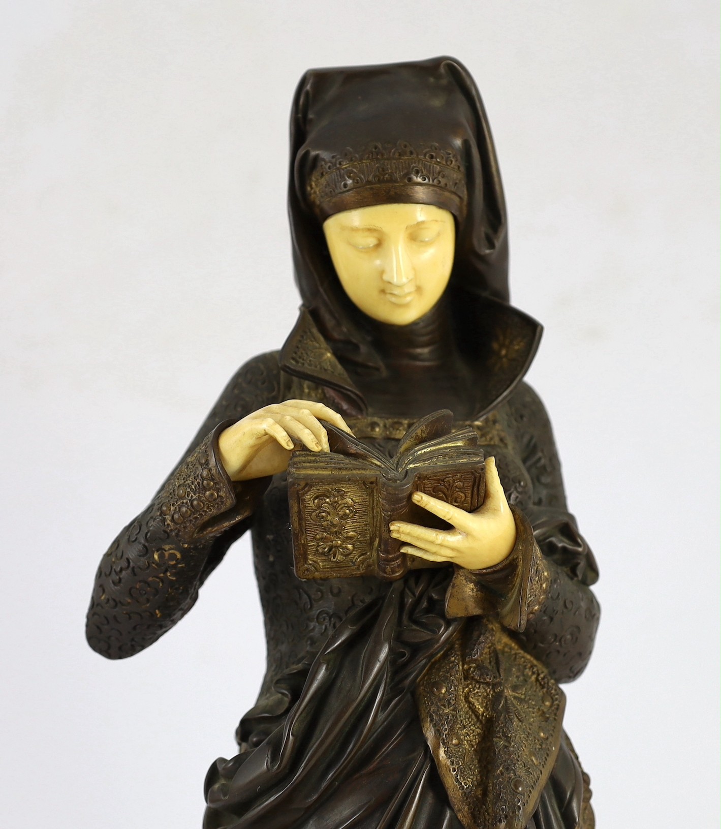 Albert-Ernest Carrier-Belleuse (French, 1824-1887). A parcel gilt bronze and ivory figure, 'Liseuse', height 60cm